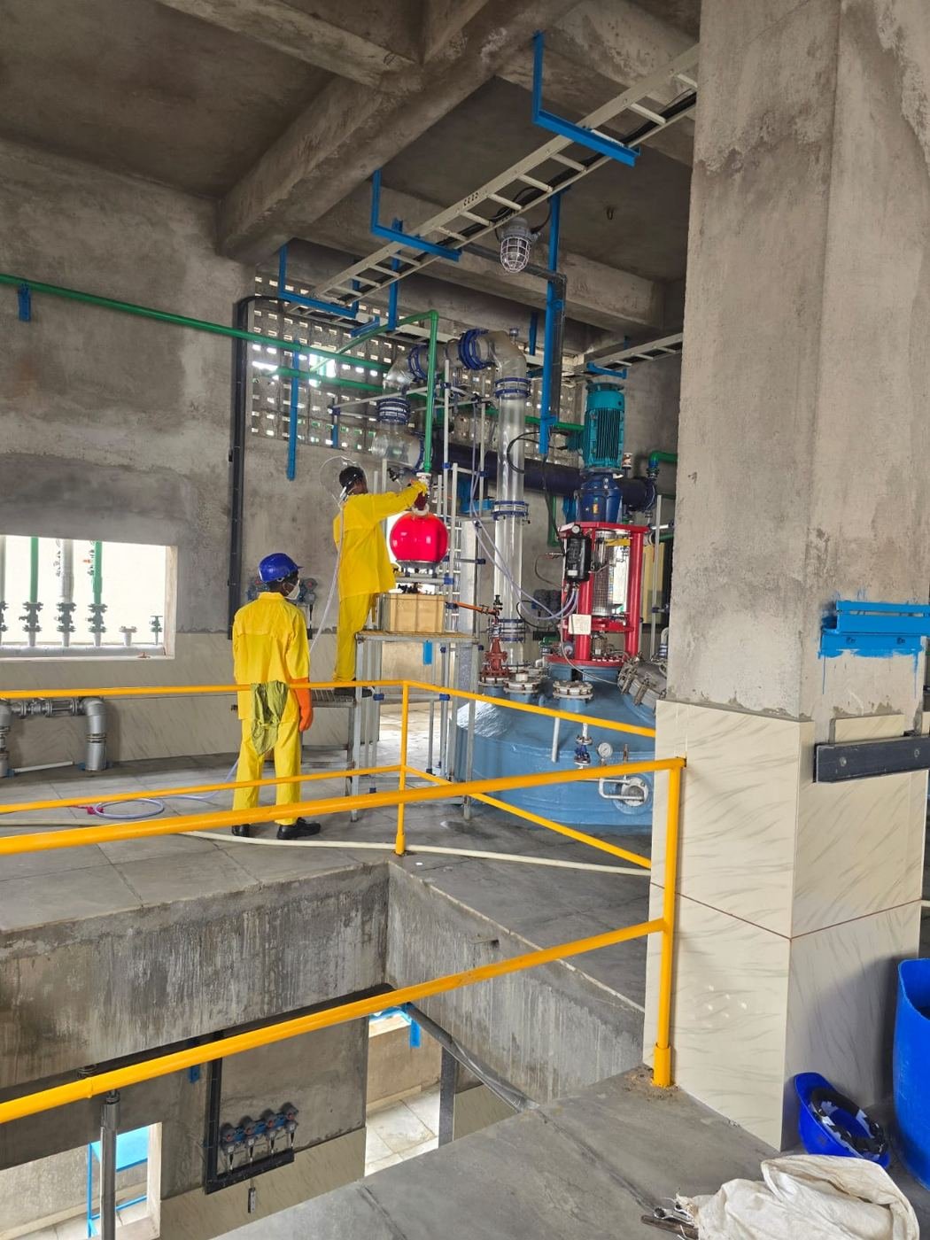 Bronopol production floor with reactor and PPE-equipped operators